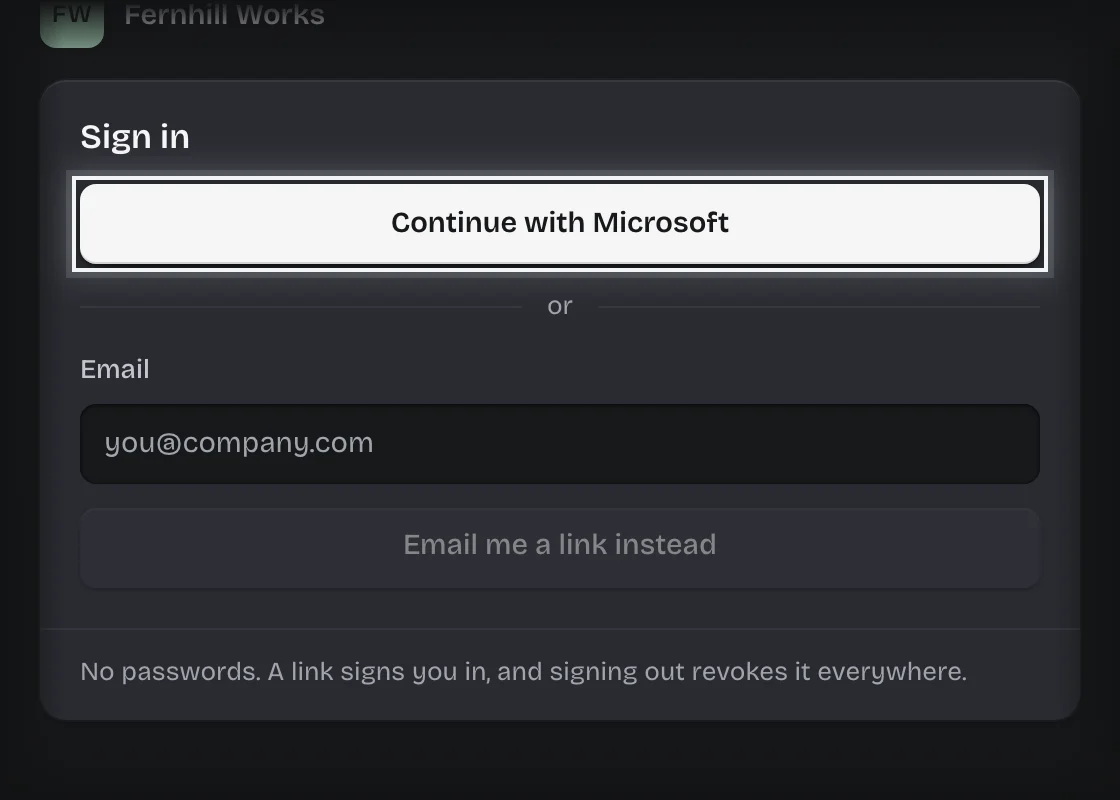 The sign-in card of a workspace with a company login: the Continue with Microsoft button outlined above the email form
